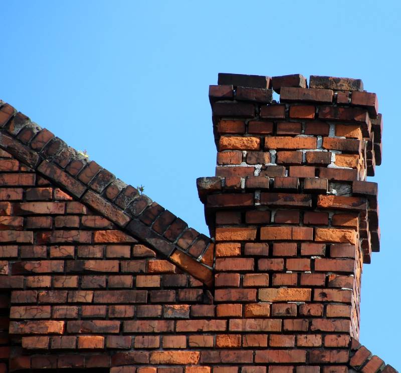 Damaged chimney on an Bellflower home showing cracks and missing mortar